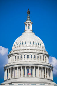 Low angle view of historical building against blue sky