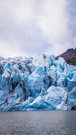 Scenic view of frozen lake against sky