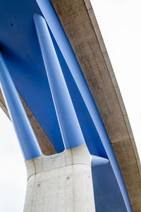 Low angle view of flag against clear blue sky