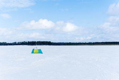 Scenic view of land against sky during winter