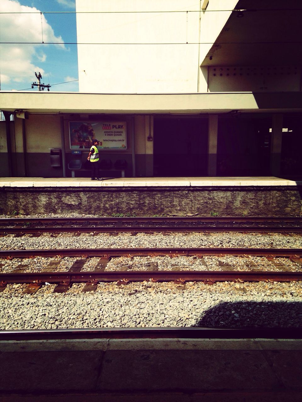 architecture, railroad track, built structure, building exterior, transportation, rail transportation, railroad station, railroad station platform, sky, public transportation, the way forward, city, travel, outdoors, diminishing perspective, day, no people, incidental people, street, low angle view