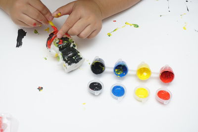 High angle view of baby hand on table