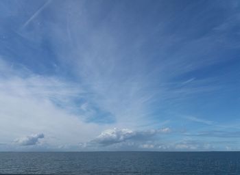 Scenic view of sea against blue sky