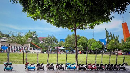 Group of people in park against sky