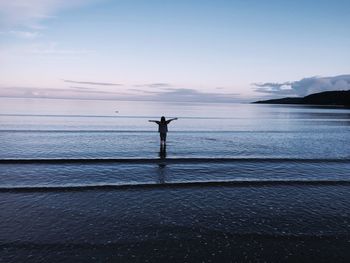 Man on sea against sky