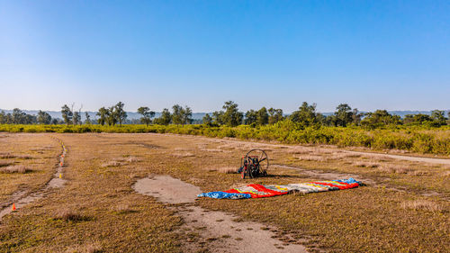 Scenic view of beach against clear blue sky