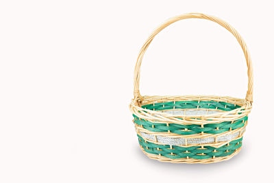 Close-up of wicker basket on white background