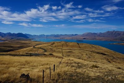 Scenic view of landscape and mountains against sky