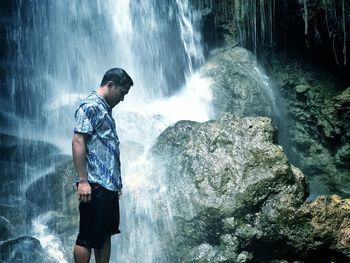 Full length of man standing on rock