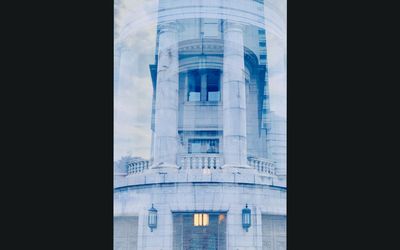 Reflection of building on glass window