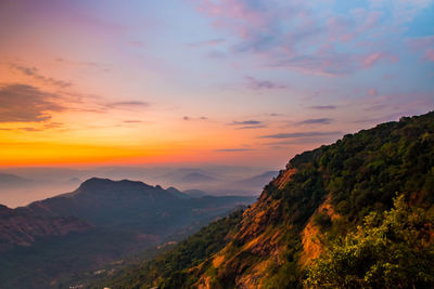 Scenic view of mountains against sky during sunset