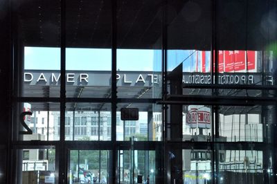 Reflection of building on glass window