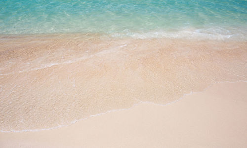 High angle view of surf on beach