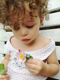 Close-up of cute baby girl eating food