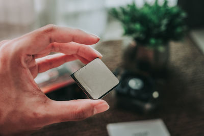 Midsection of person using mobile phone