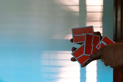 Close-up of hand holding umbrella
