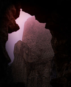 Low angle view of rock formation against sky