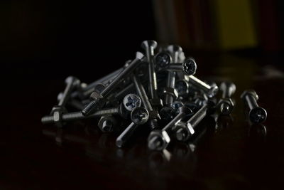 Close-up of screws on table