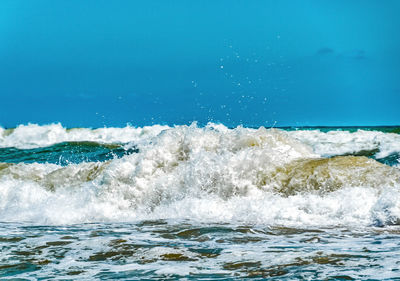 Close-up of swimming pool by sea against sky