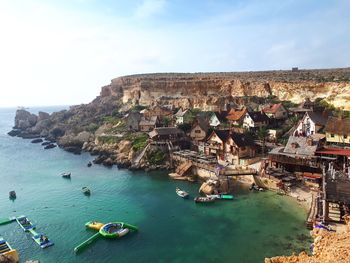 Scenic view of sea and rocks against sky