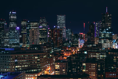 Illuminated buildings in city at night