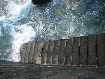 Waves breaking against sea