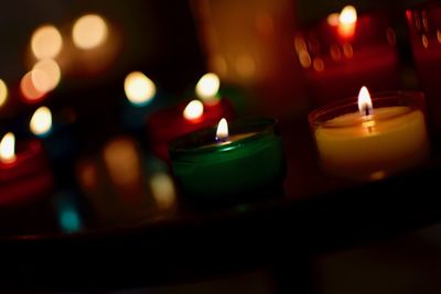 Close-up of illuminated tea light candles