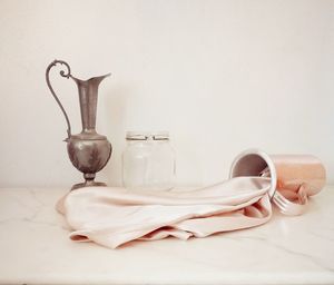 Close-up of paint on table against white background