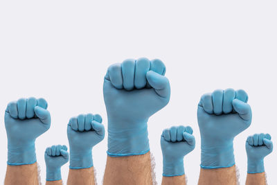 Close-up of people against blue background