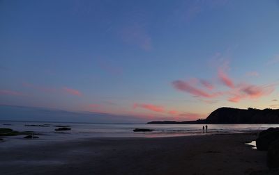 Scenic view of calm sea at dusk