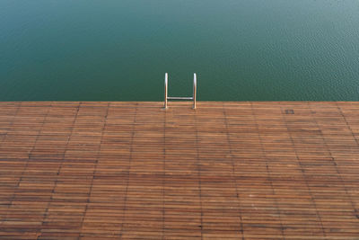 Poolside with metal railing