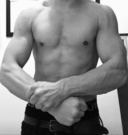 Midsection of shirtless man