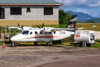 View of airplane at airport runway