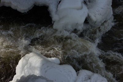 Close-up of snow covered shore