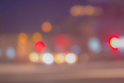 Defocused image of illuminated lights at night