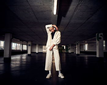 Portrait of young man standing in an empty carpark