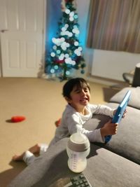 Girl looking away while sitting at home