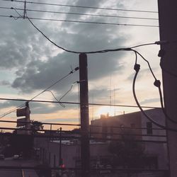 Silhouette bridge against sky during sunset