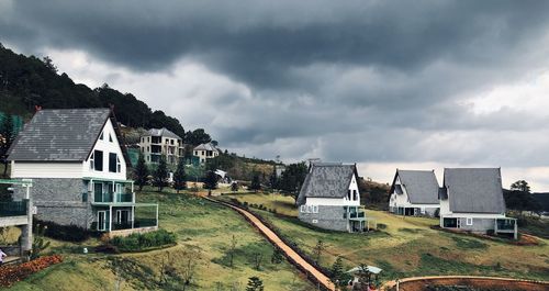 Buildings against cloudy sky