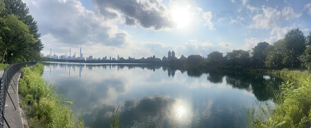 PANORAMIC VIEW OF TREES BY LAKE AGAINST SKY