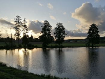 Scenic view of lake against sky during sunset