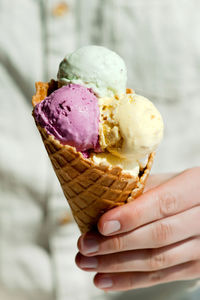 Close-up of hand holding ice cream