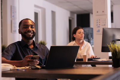 Business colleagues working in office