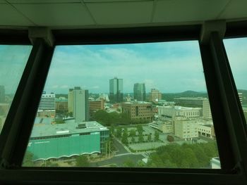 Cityscape seen through glass window