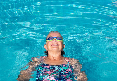 Portrait of smiling woman in swimming pool