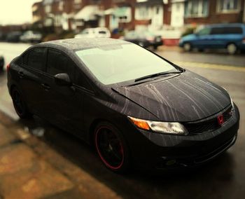 Close-up of car on street