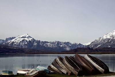 Calm lake against rocky mountains