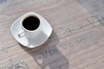 High angle view of coffee cup on table