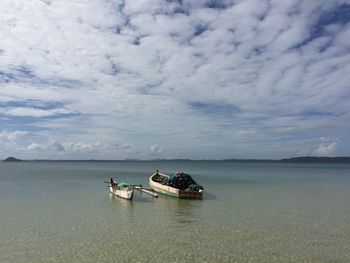 Boat on sea against sky