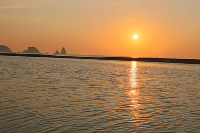 Scenic view of sea against sky during sunset